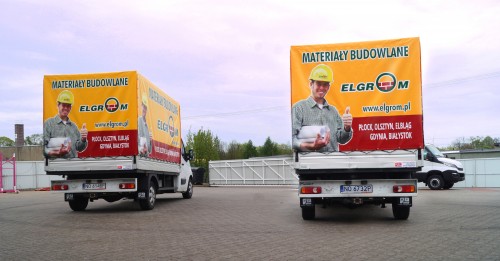 Plandeka z reklamą dla firmy Elgrom z Olsztyna. Na podwoziu Renault Master.